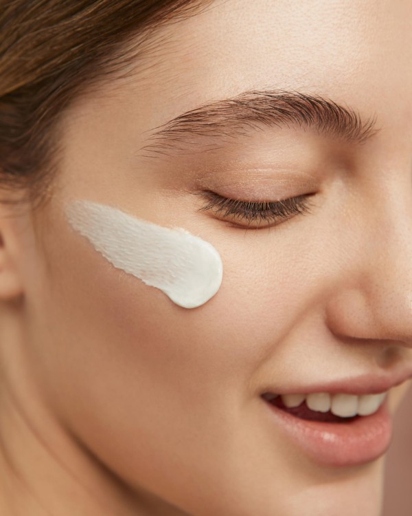 smiley-woman-posing-with-face-cream.jpg